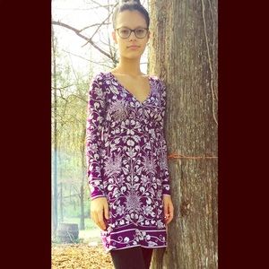 Purple dress with white flower patterns.